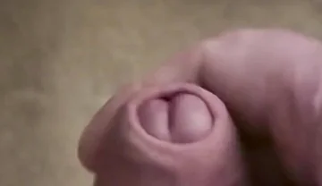 My Friend Sits in a Chair and Jerks off His Cock While Watching Video