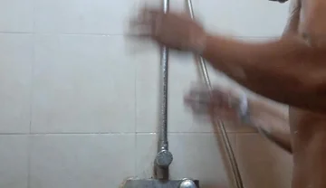 Exotic Skinned Asian Adult Man Taking a Shower in the Morning
