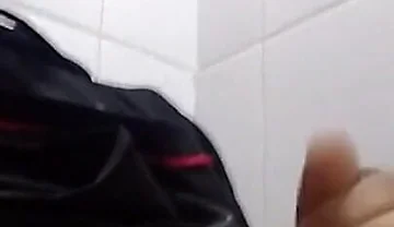 Man Sits in the Bathroom
