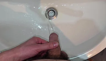 Hairy Cock Peeing Into the Sink in Bathroom with a Strong Stream