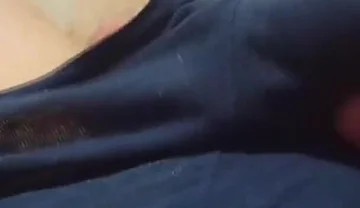 A Young Athletic Guy in Blue Shorts Is Massaging His Penis