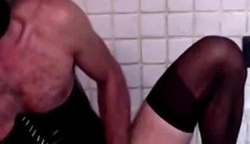 Latex Masked Sissy in Pvc Corset Cums Hard on Stockings and Heels