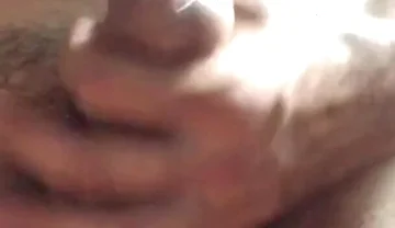 Masturbating