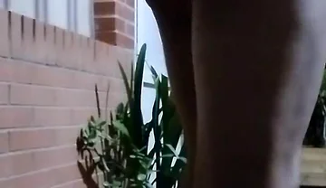 In the Doorway in a Thong and with an Anal Plug