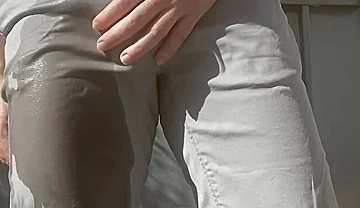 Jules Wets His Grey Pants and Exposes His Semi-hard Cock Through His Trousers
