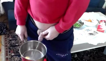 John Is Pissing Into a Kitchenpot