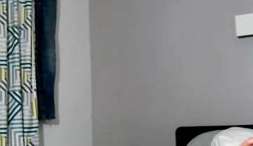 On Bed Laying Down with Socks and Beater on