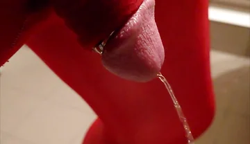 Pissing at Home in Red Legging with Penis Sleeve
