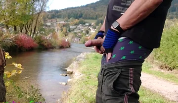 A Gay Emo Guy Jerks off His Thick Cock at Lake Tegernsee and Ejaculates His Semen Into Nature.