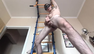 Cock Shaking While Hanging on the Horizontal Bar