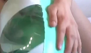 Playing with a Green and White Swimring
