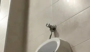 Amateur Twink Boy and Older Guy Caught Having Risky Fun in the Pool's Public Toilets