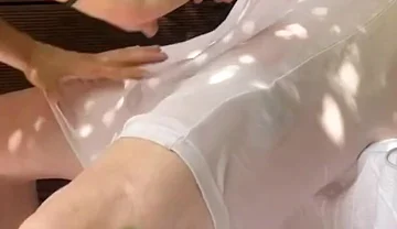 A Boy Has Fun Watering His Friend's White T-shirt and Exposing His Smooth Ass and Big Cut Cock