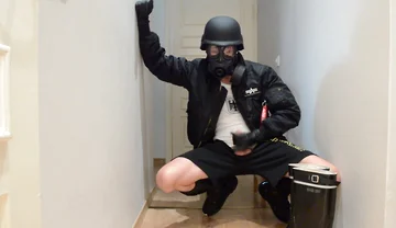 Gas masked guy cums on his rubber boots