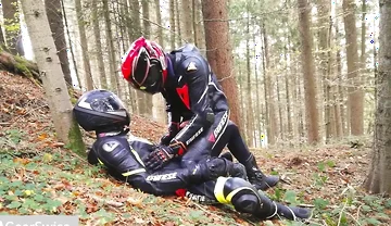 German dainese bikers having fun in the wood