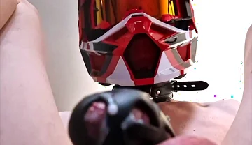 A Puppy Rides a Dildo Wearing a Helmet.