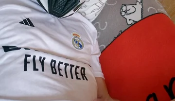 The Guy Is Wearing a Soccer Uniform and Mxhelmet with a Morning Cum