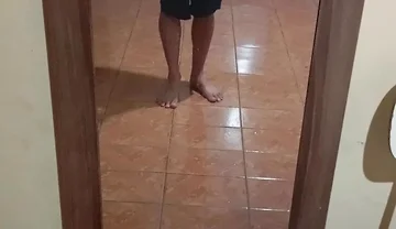 Boy in Shorts in the Mirror