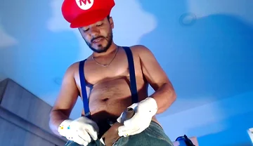 Dressed as Mario Bros Playing with His Plumbing Tool