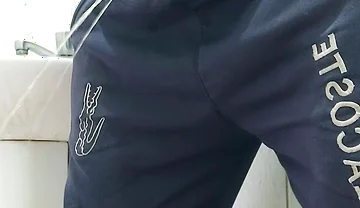 A Well-endowed Brazilian Man Urinating and Showing His Thick Penis to His Female Friends.