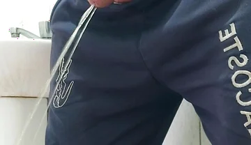 A Well-endowed Brazilian Man Urinating and Showing His Thick Penis to His Female Friends.