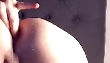 A Young Man with Fair Skin and Delicate Features Rests on the Bed