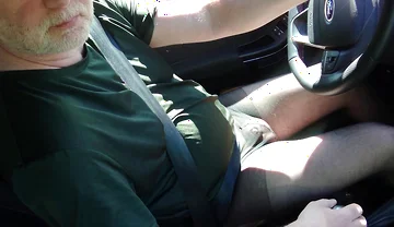 Nylonjunge Driving Car in Black Pantyhose