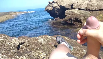 Jerking off a Big Hard Dick Overlooking the Sea in the Beach Cove Until He Cums