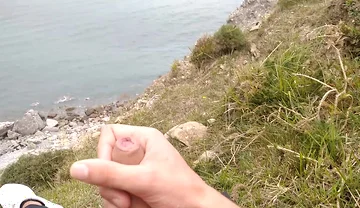 Big Beautiful Big Fat Cock Gets Handjob on the Beach with Gorgeous Sea Views