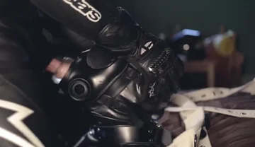 Rubber boy sucking biker master cock