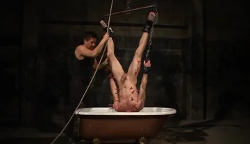 Tryp Hangs Inverted Over A Tub Of Cold Water
