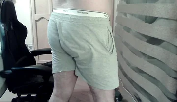 Muscular Camboy Flexes His Muscles and Squats