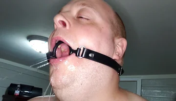 Deepthroating a 7 Inch Dildo with Mouth Gag Ring