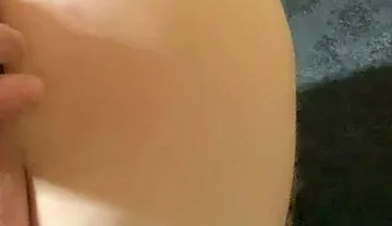 A Crossdresser in Leggings and a Seductive Bodysuit Plays with Ass