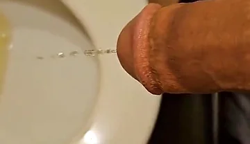 Shaved Cock Pissing