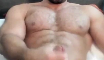 Bodybuilder Jacks off Fat Cock with Huge Cumshot