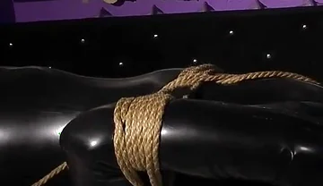 Roped in Latex: Zeus Struggles to Break Free