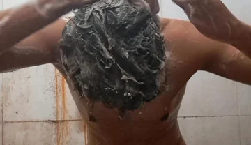 Exotic Skinned Adult Man Taking a Bath in the Afternoon