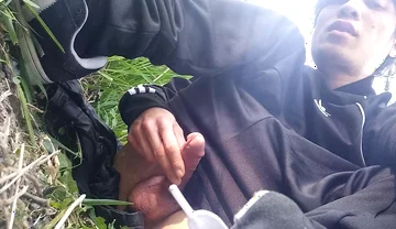 Gay boy Jon Arteen, wearing adidas tracksuit Campus sneakers, gets a hard-on outdoors