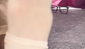 A University Rests Her Feet on Her Face so That the Adorers