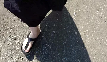 Outdoor in a Black Caftan and Barefoot in Black Birkenstocks