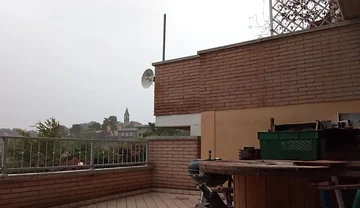 On the Terrace, in the Rain