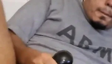 Browndicksavior Using His Oral Sex Toy and Stroking His Brown Cock