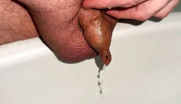 Playing with Foreskin While Peeing