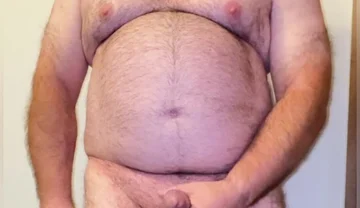 Anal Steve in His Blue Thong Showing off His Bear Body and Cock, with a Cock Ring on and Showing His Massive Butt Plug