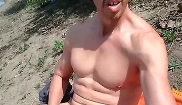 Muscle By A Lake Near People