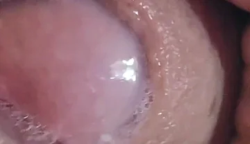 Close-up of Glans Ejaculating Intensely Before Cumming.