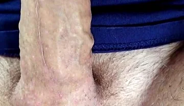 Close-up of Balls Tightening with Red Suction Vibrator